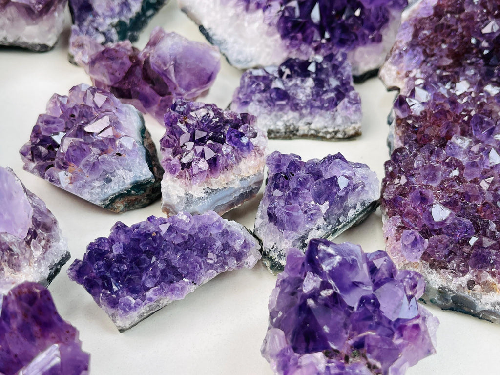Close-up of purple crystal formations on a white background